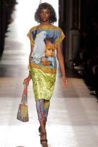 A model walking down the catwalk wearing Vivienne Westwood