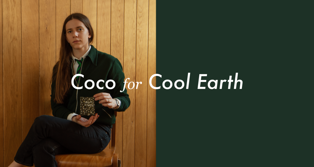 Coco Capitán for Cool Earth - Image of Coco holding her artwork