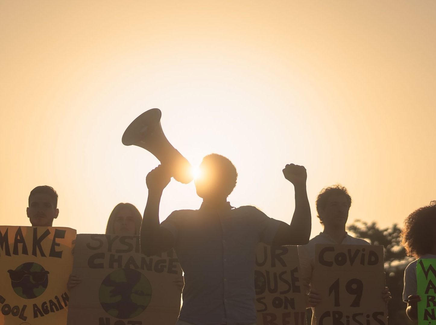 Sillhouette of a group of climate protestors.