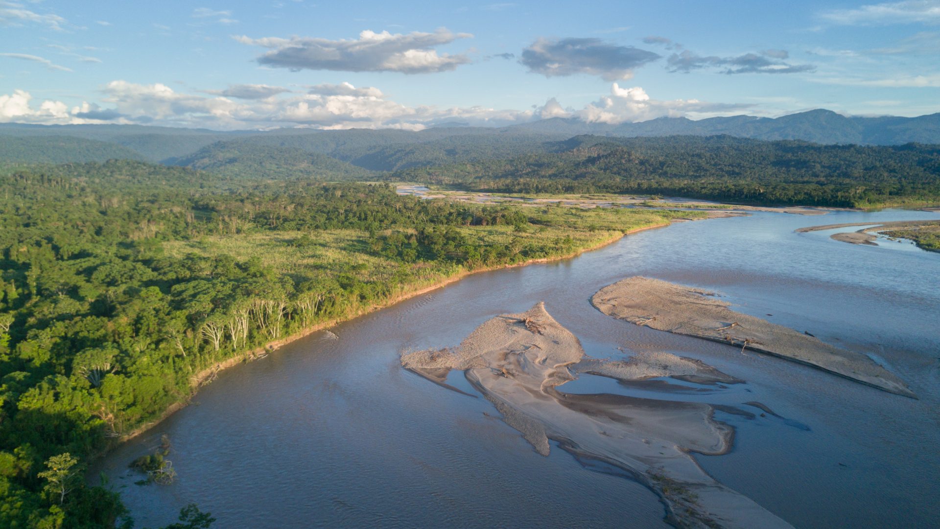 Aerial of an Amazon village by the Rio Ene river.