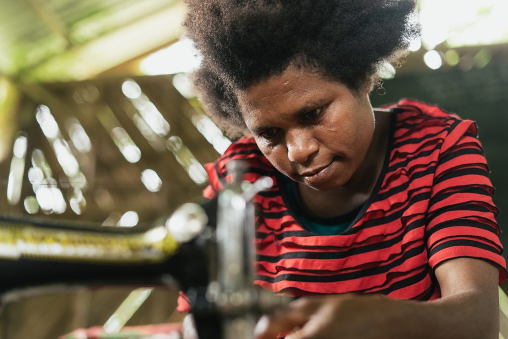 Lila, resident of Sololo and Life Skills and Education superstar developing some serious tailoring skills.