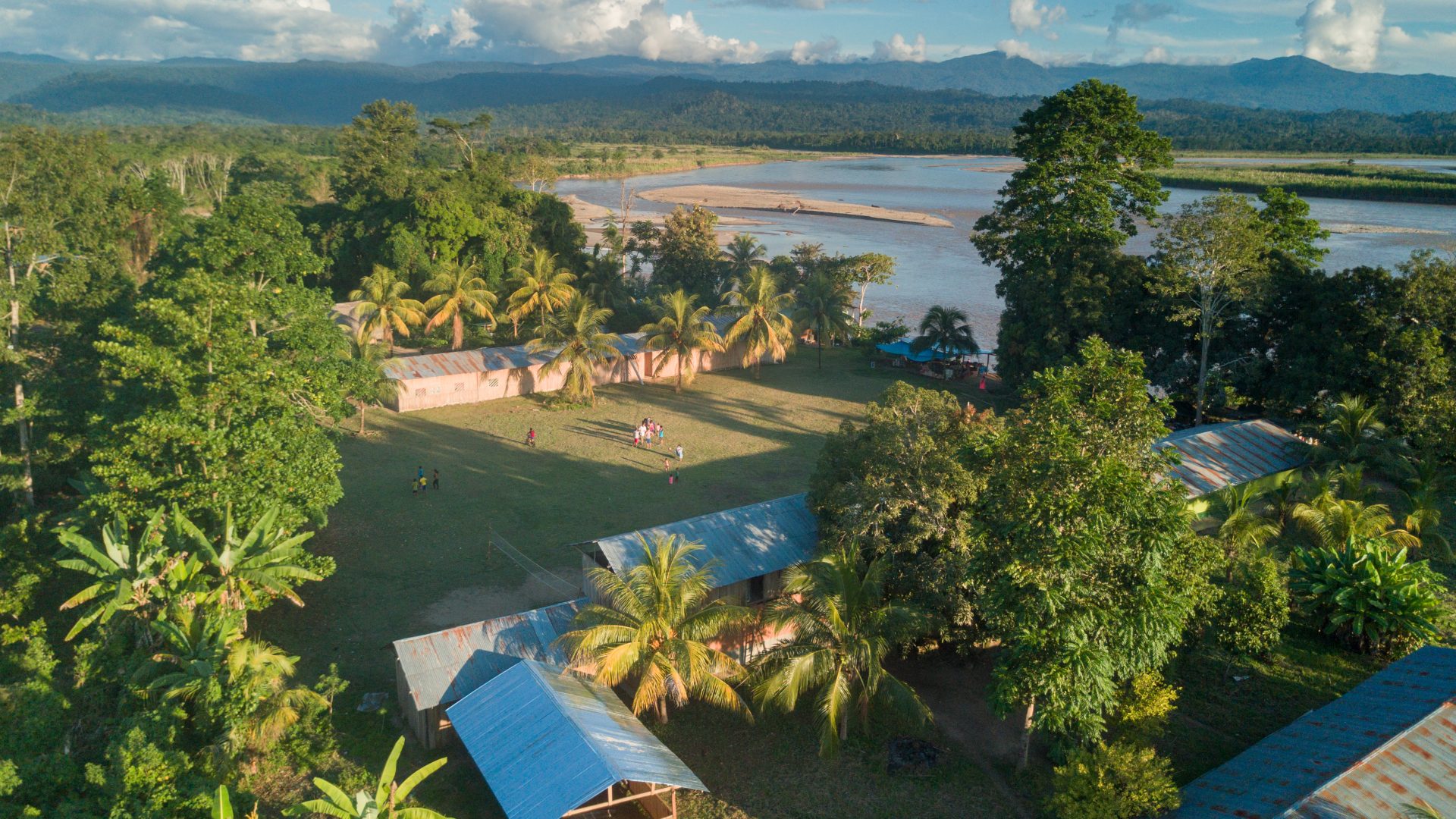 Aerial of an Asháninka village on the edge of the Rio Ene, Peru.