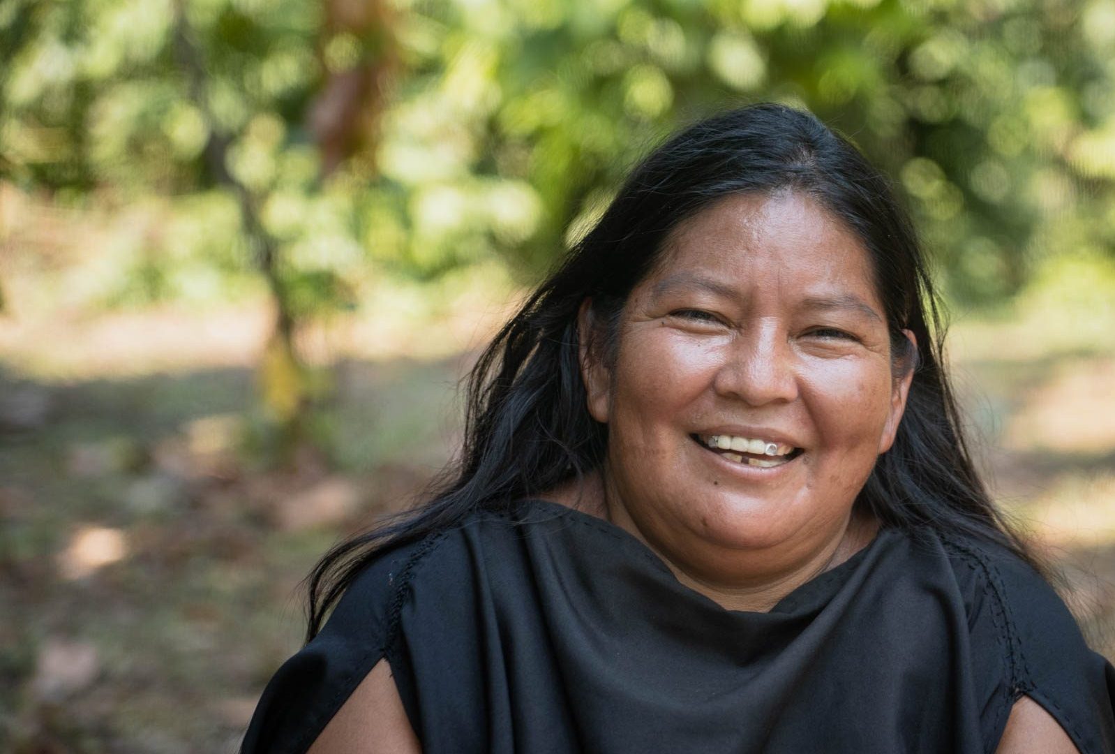 A portrait of María, an Asháninka community member who has worked with Cool Earth on sustainable income generation initiatives including cacao growing.
