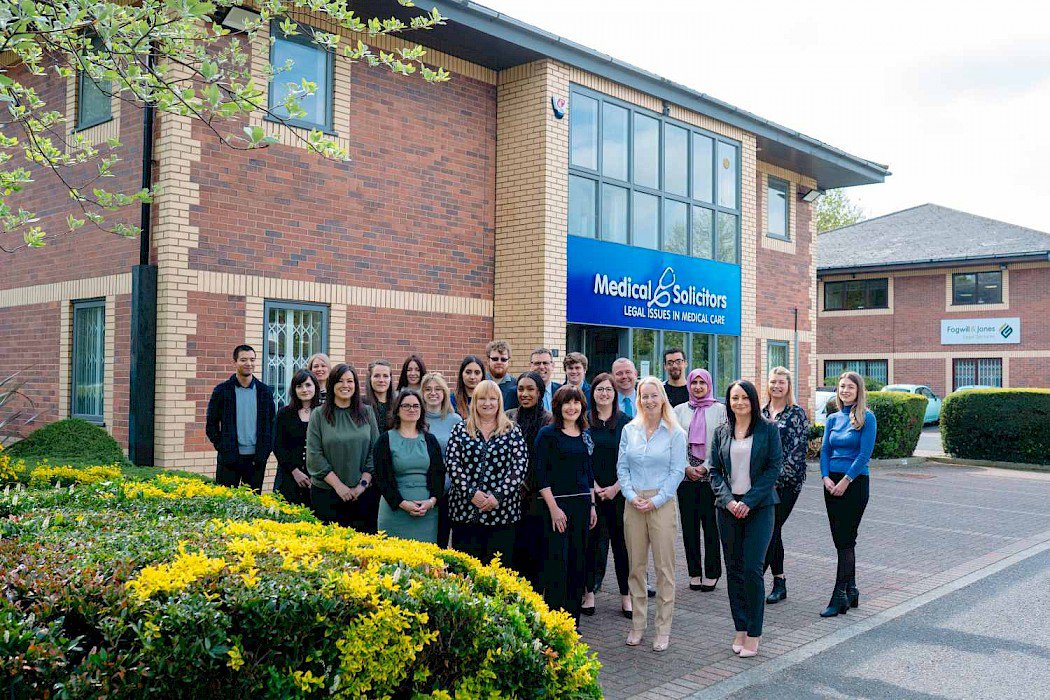 Medical Solicitors Sales Team standing together as a group outside of their Sheffield office.