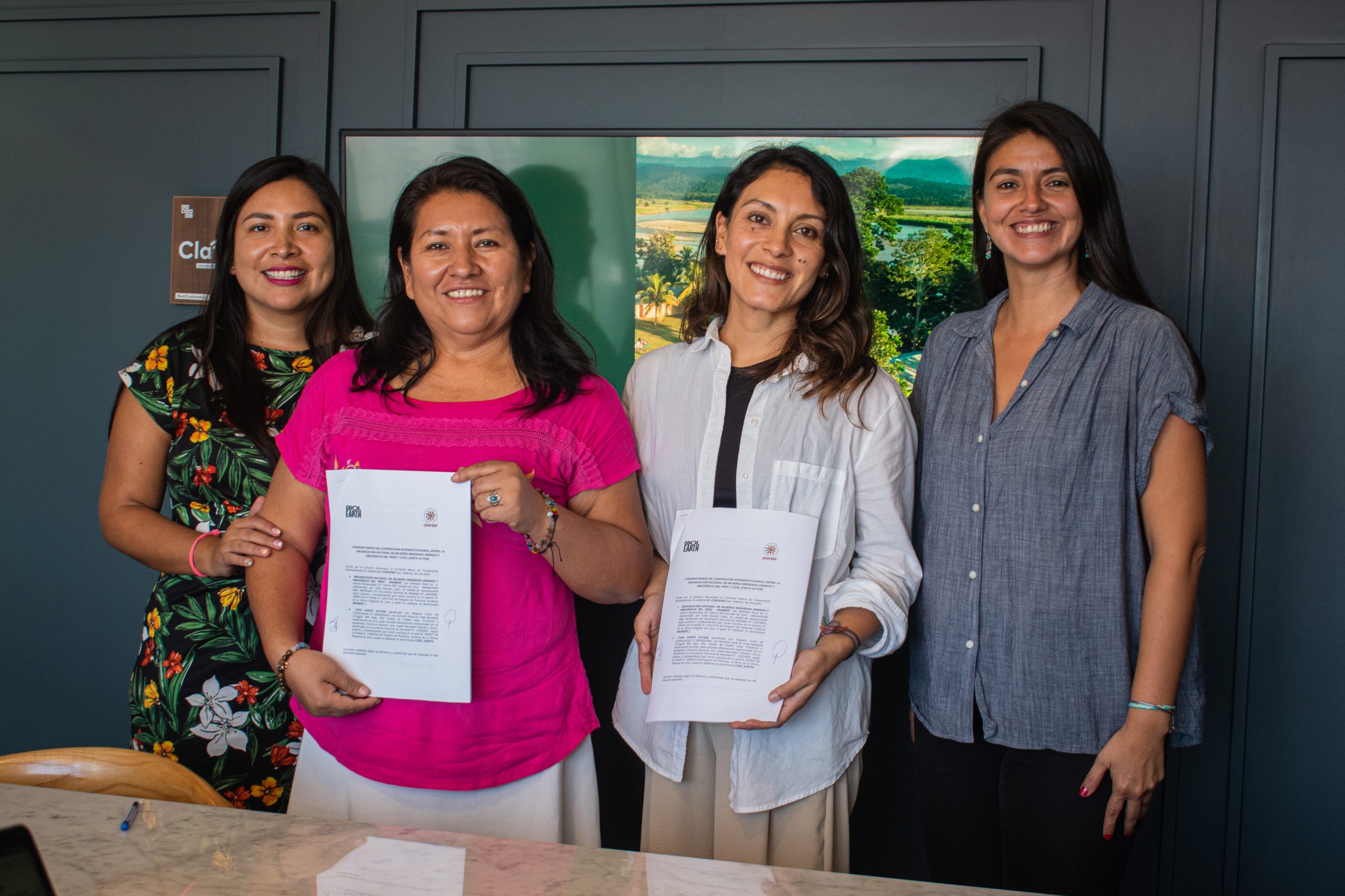 Ketty Marcelo (President of ONAMIAP), Isabel Felandro (country director of Cool Earth in Peru and Head of Programmes), Patricia Quiñones (Cash Transfers Manager, Peru) sign agreement between ONAMIAP and Cool Earth