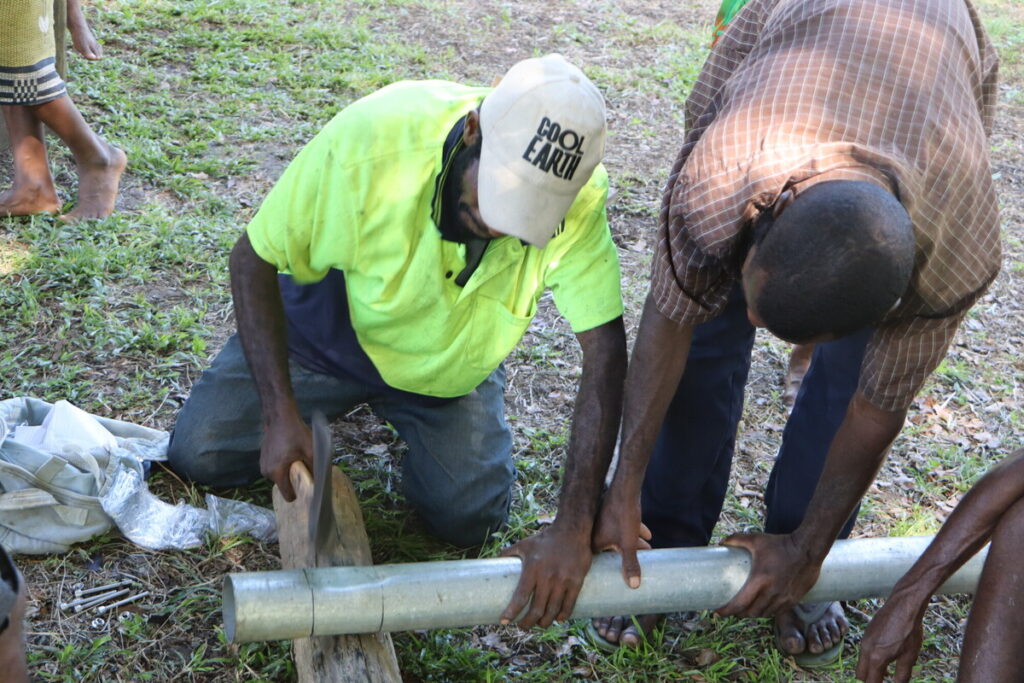 Solar street lights being installed in Sololo, Papua New Guinea.