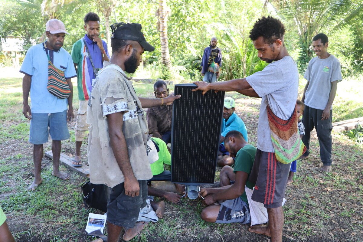 Solar street lights being installed in Sololo, Papua New Guinea.