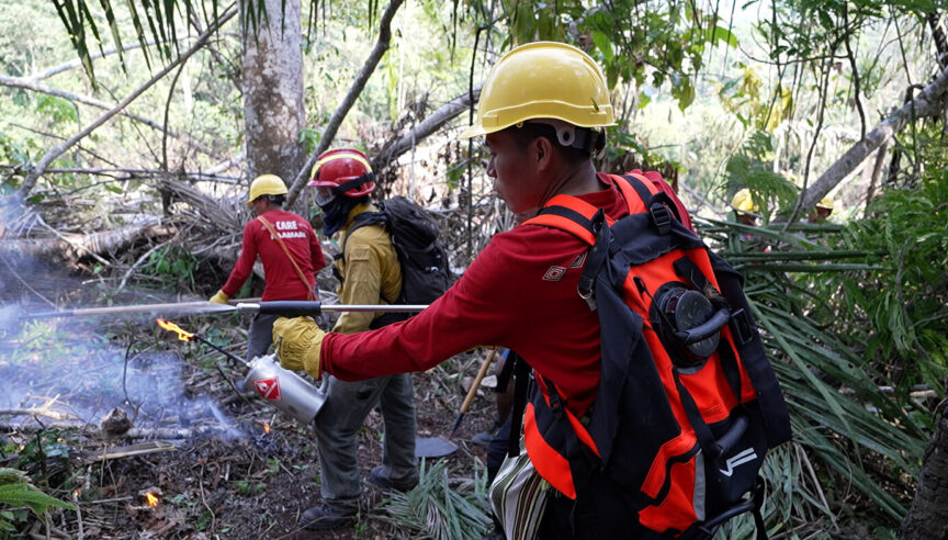 PAAMARI brigade members using fire control tools during a controlled burn exercise.